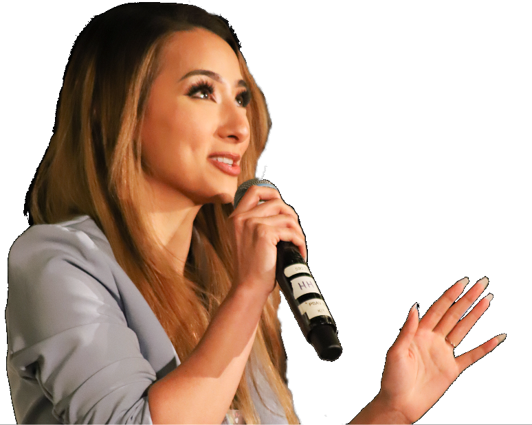 Woman speaking with a microphone in her right hand